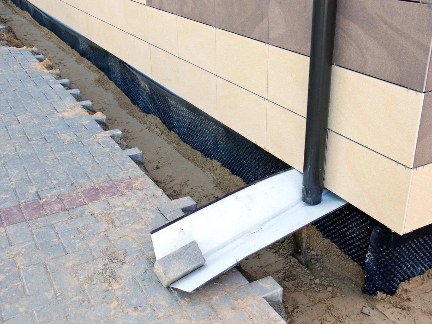 How Gutters and Downspouts Protect Your Foundation
